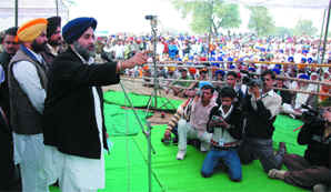 Deputy CM Sukhbir Badal addressing a rally before holding Sangat Darshan at Kotbhai village near Gidderbaha in Muktsar district on Wednesday.