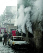 Firemen douse flames at a plastic factory near Liberty Cinema, Karol Bagh, in New Delhi on Thursday.