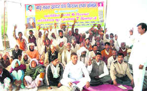 Residents of flood-affected villages observe a fast in Haridwar on Thursday.