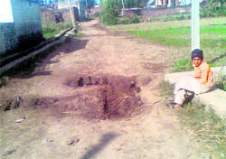 A kutcha track leading to Swankha village, which has been declared Model Village