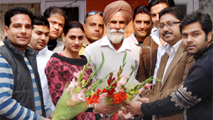 Activists of the BJP Sports Cell felicitate Asian Games gold medalist Manjeet Kaur in Jalandhar on Thursday.