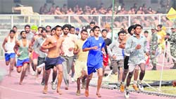 Candidates participate in the 1600 metre run during an Army recruitment rally in Ludhiana on Thursday.