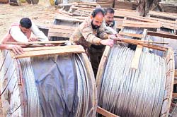Power staff members work at a grid station in Patiala on Thursday despite a strike call given by the Employees Joint Forum.