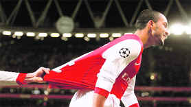 Arsenal's Theo Walcott celebrates his goal against Partizan Belgrade in London on Wednesday.