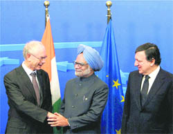 Prime Minister Manmohan Singh shakes hands with President of European Council Herman Wanrompuy (L) as European Commission President Jose Manuel Barroso (R) looks on, before a Plenary Session of India-EU Summit at the European Union Headquarters in Brussels, Belgium, on Friday.