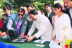 Chief Minister Ramesh Pokhriyal Nishank inaugurates the State Bar Councils website in Dehradun on Friday.