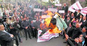 Lawyers burn the effigy of V K Gupta, former Chief Justice of the HP High Court, against the move to shift the court complex, in Shimla on Friday.