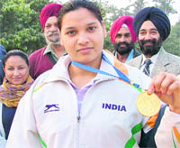 Konika Kumari displays her gold medal in Ludhiana