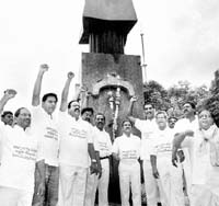 TRS legislators shout slogans demanding release of students booked by police during the Telangana agitation, on the first day of winter session of the state Assembly in Hyderabad on Friday.