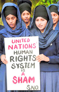 Students from Gursikh Phulwari Public School hold a protest in Patiala on International Human Rights Day against inaction on the turban issue in France, on Friday