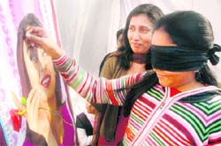 A girl takes part in a game during the kids carnival at CL Aggarwal DAV School, Sector 7, Chandigarh, on Saturday. 