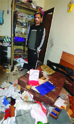 Ashish Bhuwan shows his ransacked house at 
