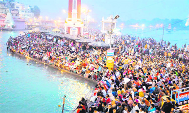Devotees at the Har-ki-Pauri during the evening Ganga aarti in Haridwar on Saturday. Tribune photo: Rameshwar Gaur