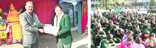 Chief guest VK Singh presents an award to a Tibetan student; and (right) children listen to the address of the dignitaries during a function in Mussoorie on Friday.