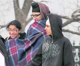 Chill forces tourists to use blanket in Shimla. 
