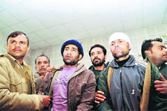 Hizbul Mujahideen militants Ghulam Nabi (right) and Tanveer Ahmed (left) in the custody of the Uttarakhand Police