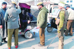 Policemen check vehicles during a search operation in Srinagar on Saturday, after security agencies got inputs regarding the presence of militants and their plan to launch an attack.