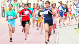 Participants during the 600-metre race on the opening day of the 56th Punjab State Schools Athletics Meet in Ludhiana on Saturday.