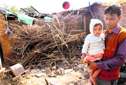 One-and-a-half-year-old Nirmal with a neighbour after her mother was admitted to the PGI with 70 per cent burn injuries