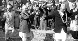 Nepalese senior citizens dance with members of Mohali Senior Citizens Association at a farm house on the 