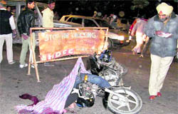 The mangled remains of the motorcycle at the YPS Chowk in Mohali, where Rajan Vinayak was killed in an accident on Sunday