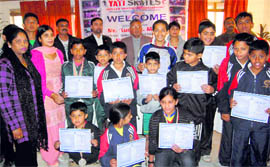 Ice-skaters with certificates at a function in Dehradun on Sunday