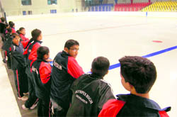 Ice-skaters from various schools watch the rink in Dehradun on Sunday