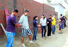 Students of Doon School, Vivek School, Chandigarh, and Maharani Gayatri Devi School, Jaipur, help in the construction of a school building at Daandapur village, near Dehradun, on Saturday
