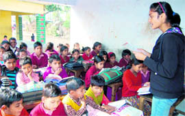 A student of Maharani Gayatri Devi School, Jaipur, teaches at a school at Daandapur village, near Dehradun, on Saturday