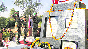 Officers of the Tithwal Brigade pay homage to Second Lieutenant Shantaram at a war memorial close to the LoC in Laam sector on Sunday. Photo: Ravi Krishan Khajuria