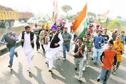 Activists of the Punjab Youth Congress march through Ladhowal on Sunday.