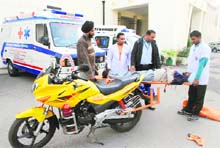 An ambulance and motorcycle donated by @@Dr Amrik Singh Chattha (right) at Rajindra Medical College and Hospital in Patiala on Sunday. 