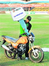 Bangladeshi cricket team captain Shakib Al Hasan poses with a motorcycle and a mock key during a prize giving ceremony for Most Valuable Player following the final ODI against Bangladesh in Chittagong on Sunday. Bangladesh won the five-match series 3-1. 