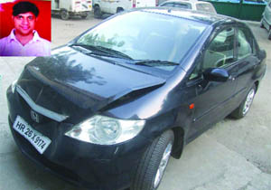 The car of Hemant Gupta (inset) who was murdered at Vikas Puri in west Delhi on Monday. 