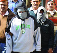 The accused in police custody in New Delhi on Monday.