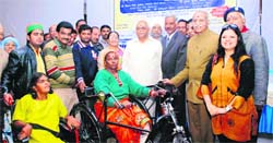 Physically challenged being given wheelchairs at a function in Dehradun on Sunday. 