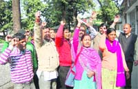Members of the Devbhoomi Mahasabha hold a protest in Dehradun on Monday.