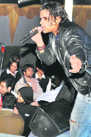 A member of the group "Bandish" performs at Management Development Institute in Gurgaon on Sunday. 