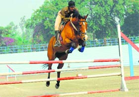 A horse rider of the Haryana police in action during a show organised on the visit of Ajay Maken, Union Minister of State for Home Affairs, to the Haryana Police Academy in Madhuban