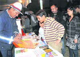 A policeman explains traffic rules during an exhibition organised by the district police in Karnal