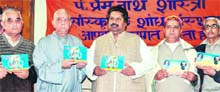 Raman Bhalla,Minister for Revenue,Relief and Rehabilitation releases a volume of Vijeshwar Panchnag,written by Pandit Omakar Nath Sharma at a function in Jammu on Monday.