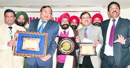 Members of the Ludhiana branch of IMA with the best branch award presented to them by the