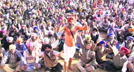 Activists of the Water Supply and Sanitation Muster Roll Employees Union stage a protest against the state government in the Lambi area in Muktsar district on Monday.