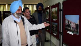 Vice-chancellor of the Central University of Punjab Dr Jairup Singh shows photographs of stage-wise development of the universitys transit campus located on the Talwandi Sabo road in Bathinda, on Tuesday.
