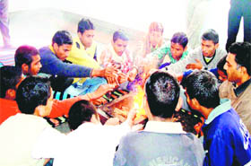 Inmates of Child Reform Home take part in a yajna at Roshanabad in Haridwar.
