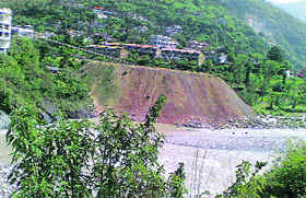 Heaps of debris dumped near the Bhima Kali temple along the Beas river in Mandi.