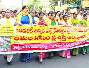 Legislators of the CPI, the CPM and the TDP hold a march against the Congress over the plight of farmers, in Hyderabad on Tuesday.