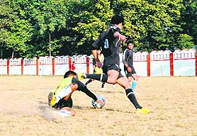 Players in action at the Shivalik Football Cup Tournament being played in Dehradun on Wednesday.