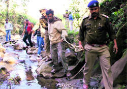 Murder accused Rajesh Gulati being taken to the forested area near Rajpur to search for Anupamas body parts on Wednesday