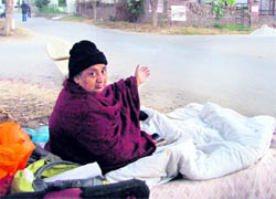 Paramjit Kaur sits near her plot at Shaheed Bhagat Singh Nagar in Ludhiana